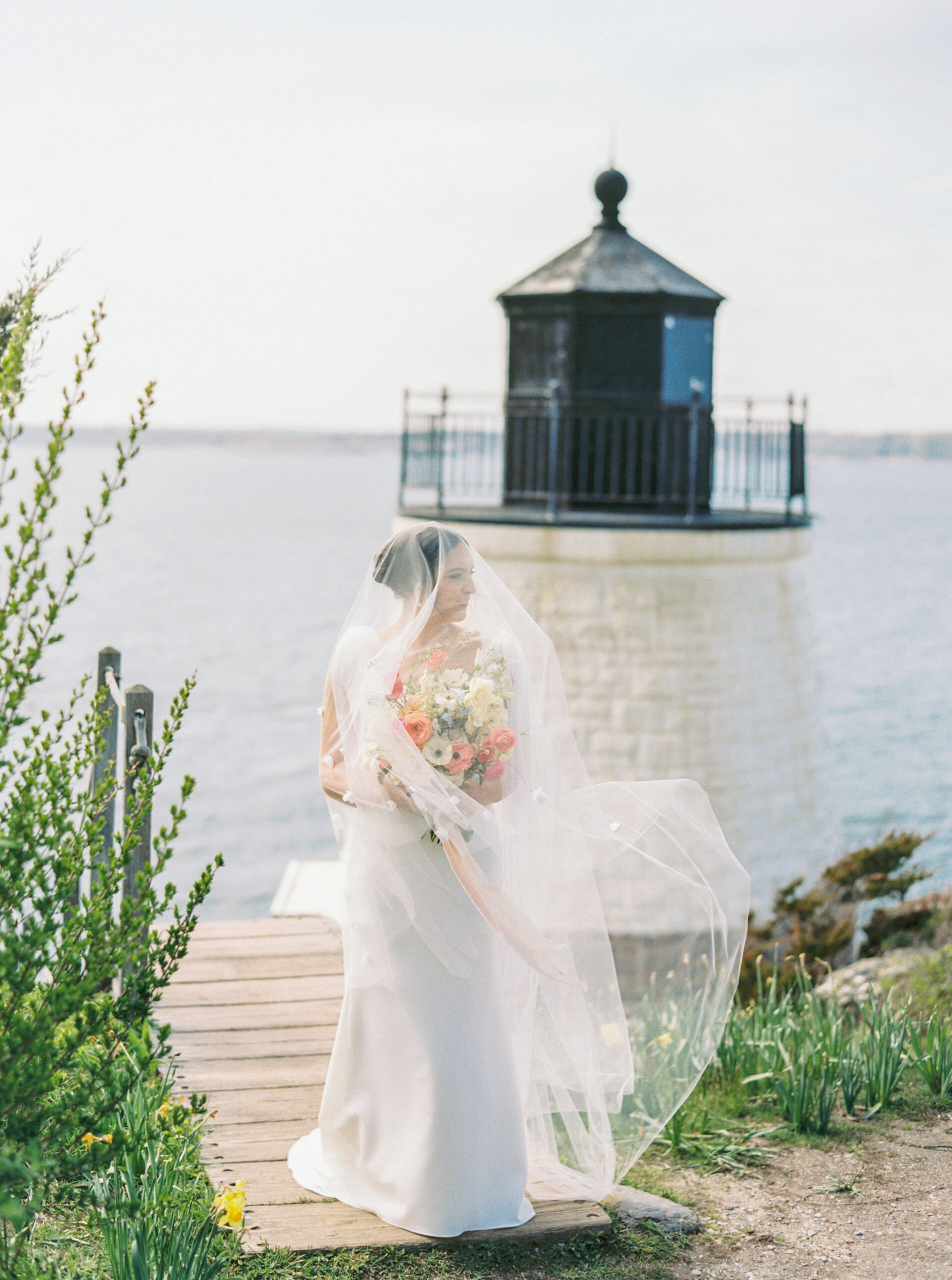 Bride and groom with a vintage Rolls-Royce outside Castle Hill Inn in Newport, Rhode Island, photographed by Schwalbs Photography, a Newport wedding photographer.
